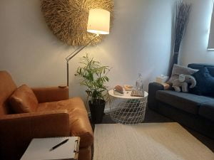 Cosy living room with stylish furniture and warm lighting.