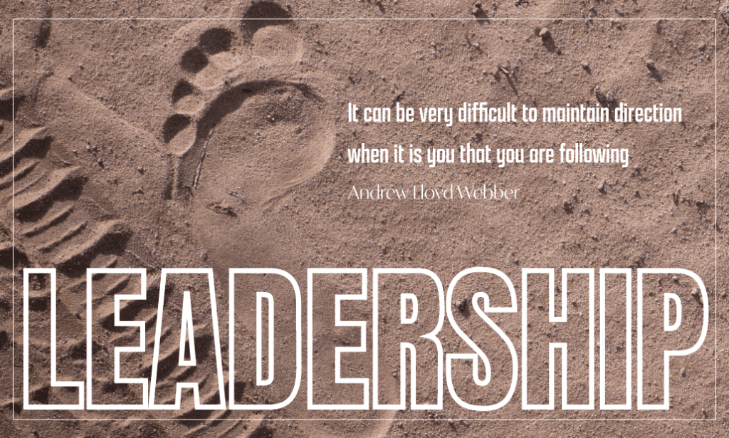 Footprint in sand with Quote ""It can be very difficult to maintain direction when it is you that you are following" â€“ Andrew Lloyd Webber"
