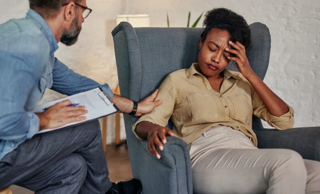 Caring counselor listening to female patient