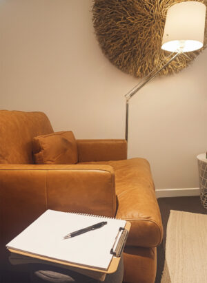 Cosy lounge area with lamp and notepad